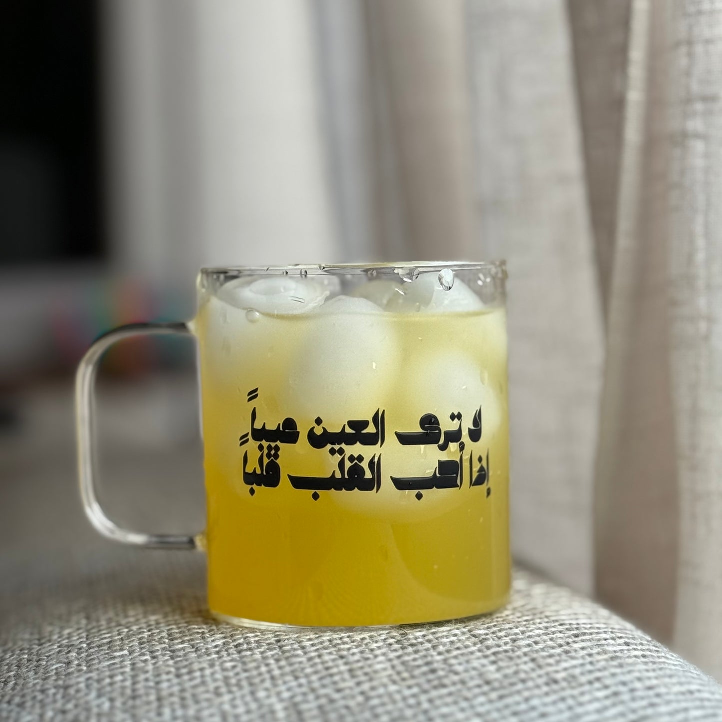 A glass cup with arabic saying.